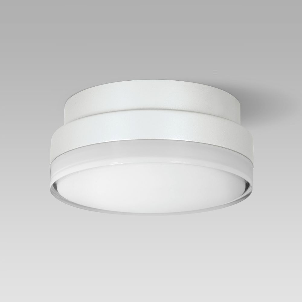 Compact-size and resistant ceiling or wall-mounted luminaire for indoor and outdoor lighting